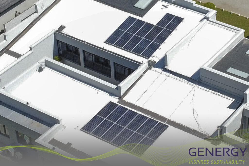 Reduce you electricity consumption Solar panel installation on residential houshold with writing: GENETRGY inspired sustainability