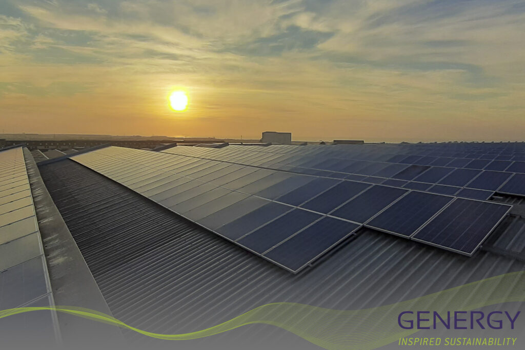 Sunrise over solar panels on roof top with writing: GENERGY Inspired Sustainability