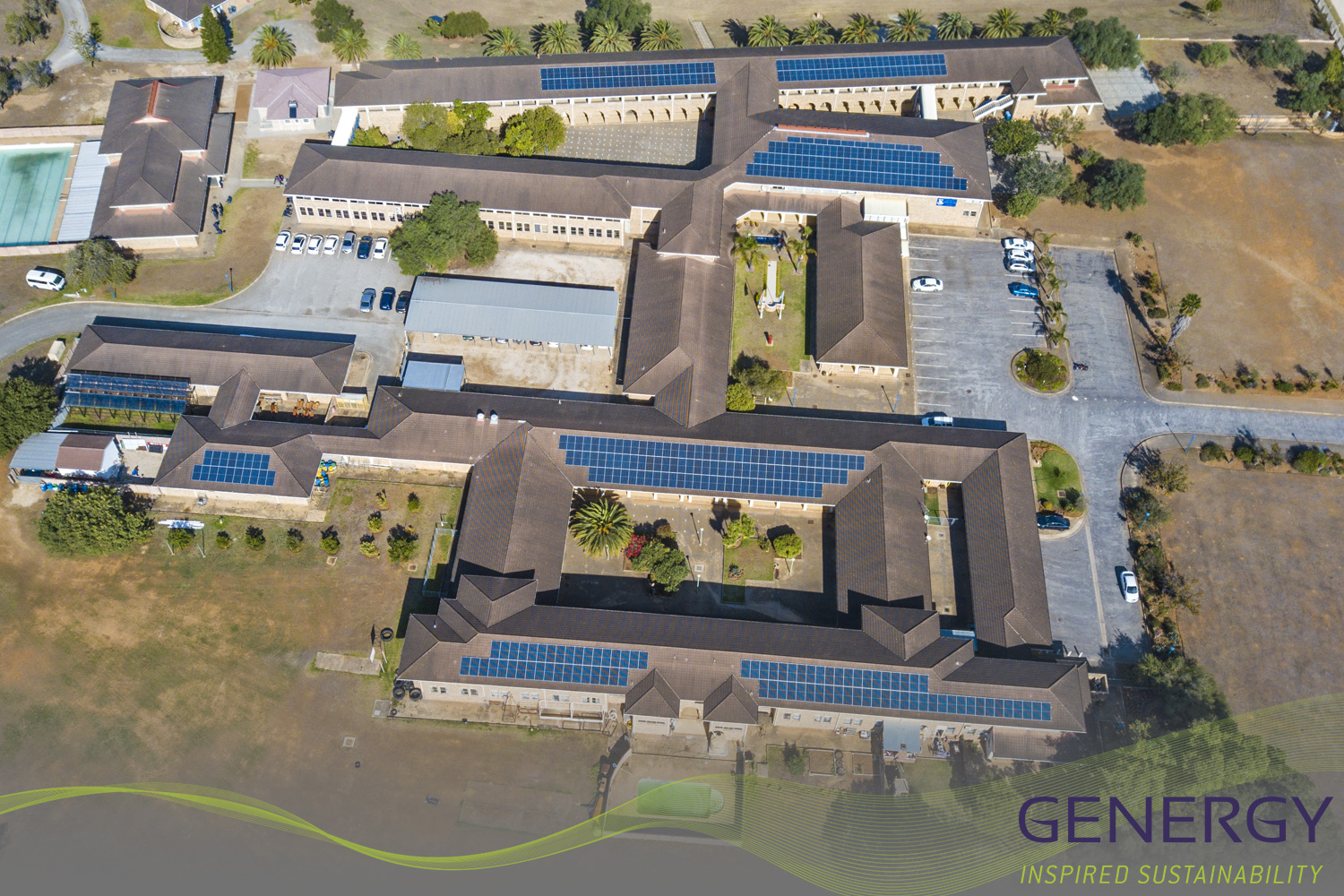 Aerial foto of Solar installation on roof top with writing: GENERGY, Inspired sustainability