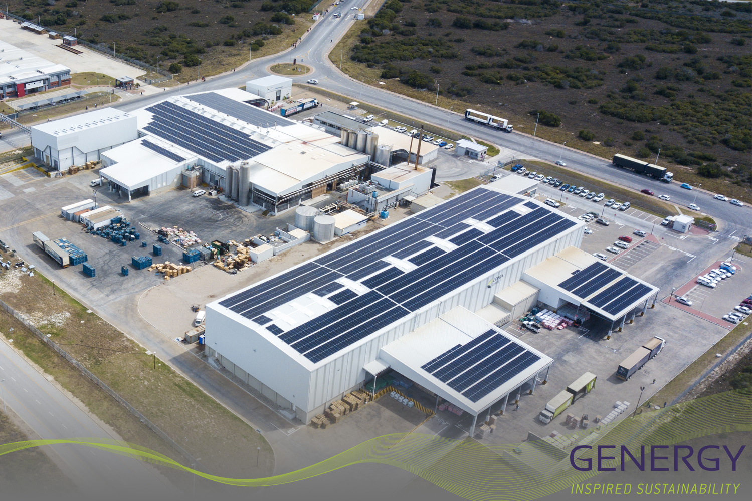 Large Solar panel installation on roof top with writing: GENERGY Inspire Sustainability
