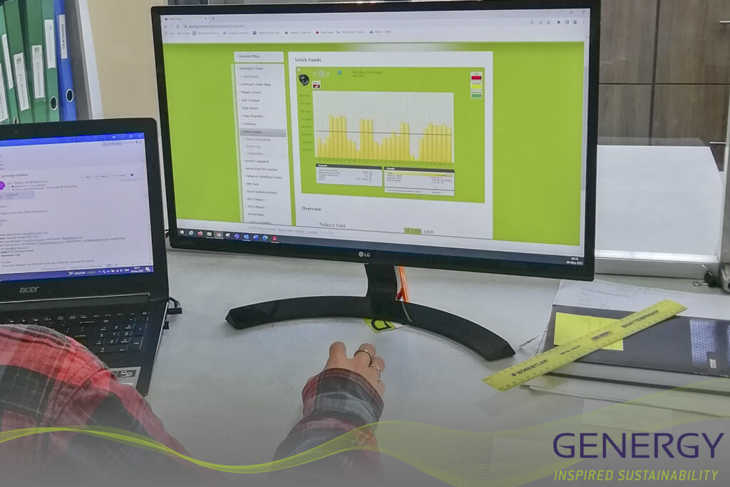 Person at desk checking Monitoring software with writing GENERGY Inspired sustainability