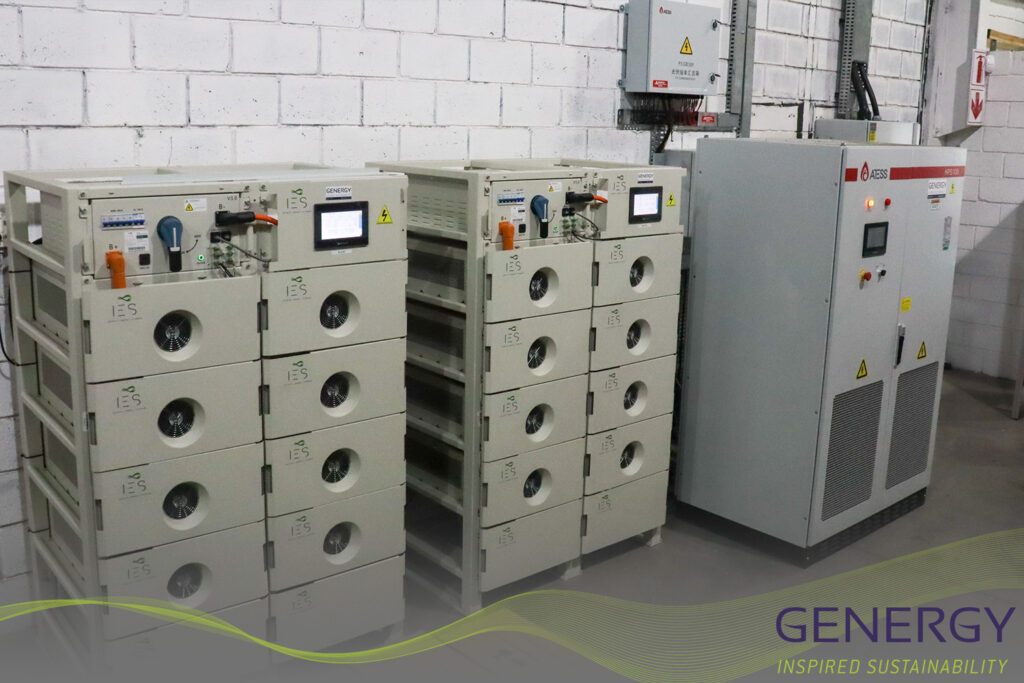 Solar inverter panel with green lines logo at bottom and writing in bottom right: GENERGY, Inspired sustainability