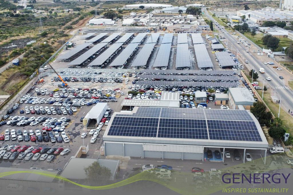 Aerial image of Solar installation on carport with road next to it with green lines at bottom of image and writing in bottom right corner: GENERGY, Inspired sustainability