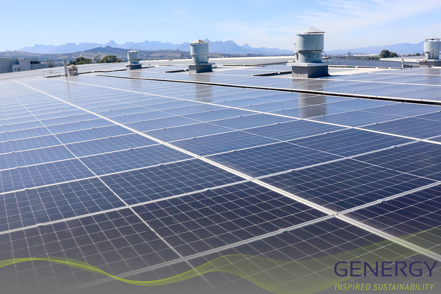 Solar Panels on rooftop with green lines at bottom of image and writing in bottom right corner GENERGY, Inspired sustainability