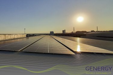 Sunrise on rooftop with Siolar panels and writing: GENERGY, Inspired Sustainability